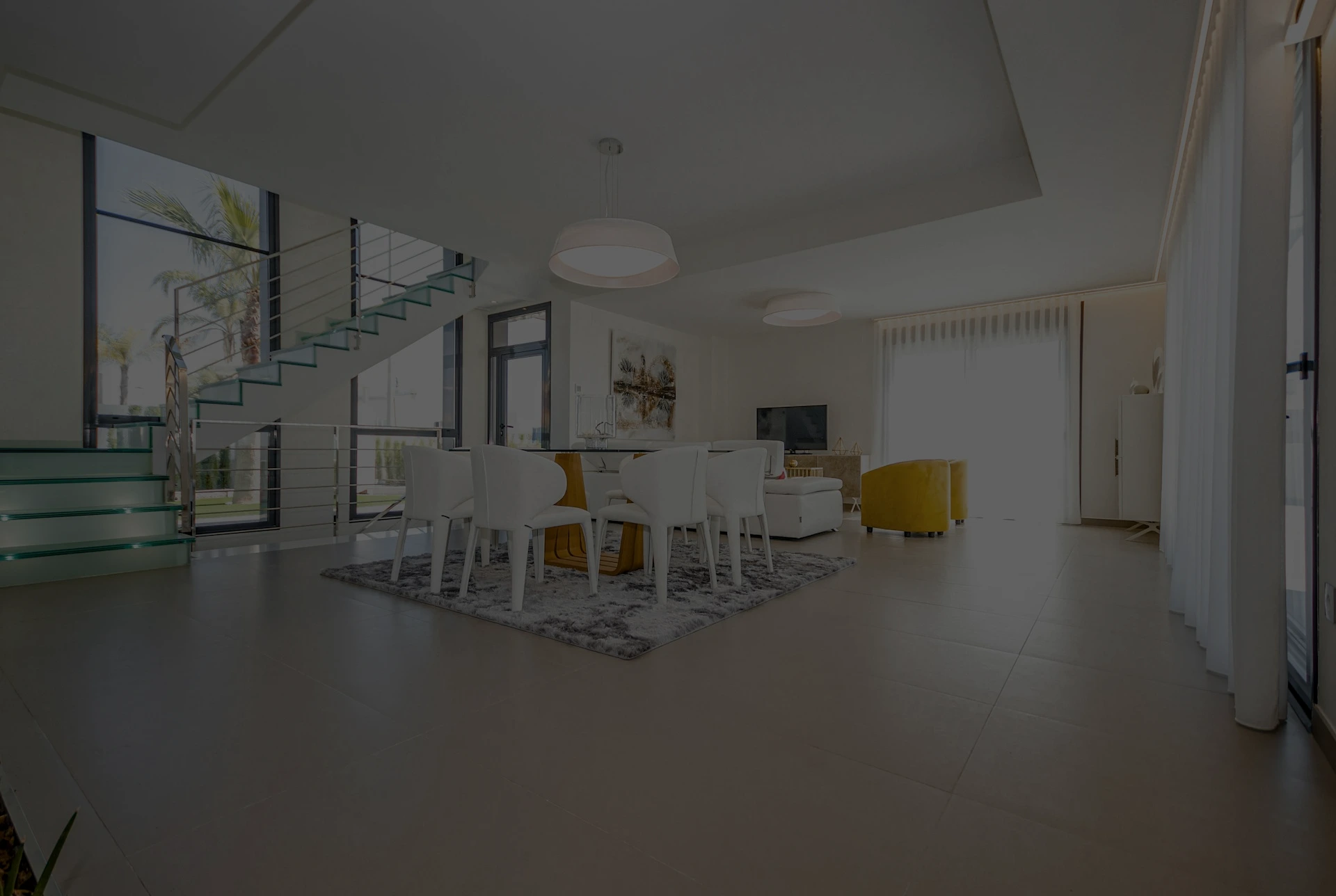 white chairs and table on white floor tiles